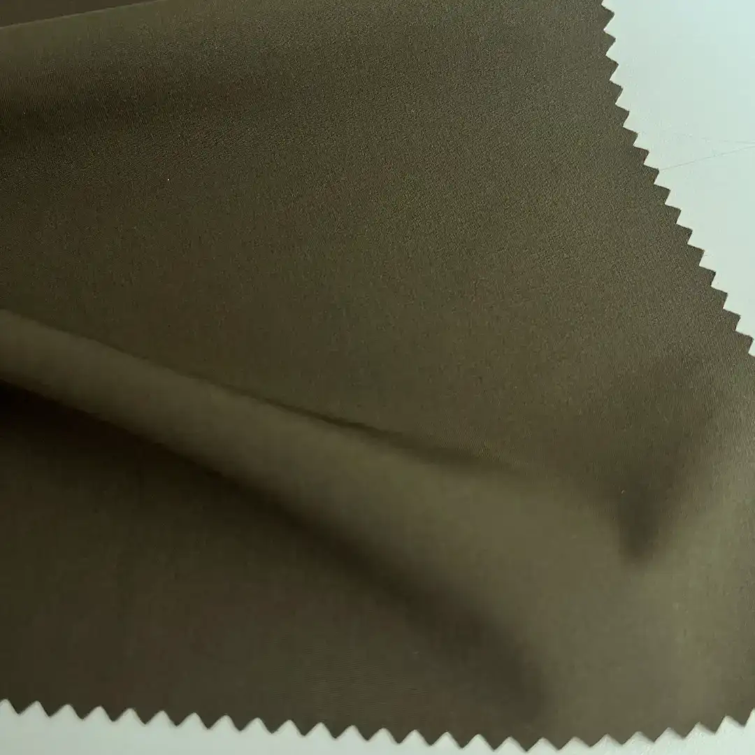 China Fabric for Jacket,Tracksuits,Hoodie Four Stretch Polyester Woven Fabric Synthetic Woven Fabric Polyester Spandex Green color buy from China wholesaler bulk order at wholesale price free worldwide shipping Alibaba