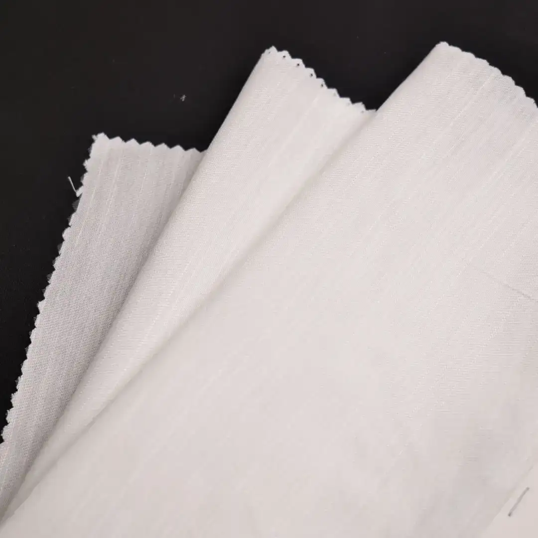 China Fabric for Blouse,Skirt,Shirt Long Sleeve Button ,Over Shirt Nylon/Rayon Bengaline Woven Blended Fabric Rayon Nylon White color buy from China wholesaler bulk order at wholesale price free worldwide shipping Alibaba